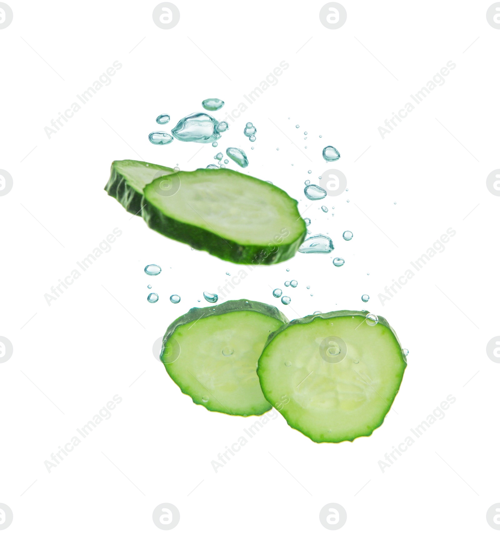 Photo of Fresh cucumber slices in water on white background