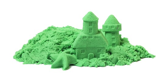 Photo of Castle figures and starfish made of green kinetic sand isolated on white