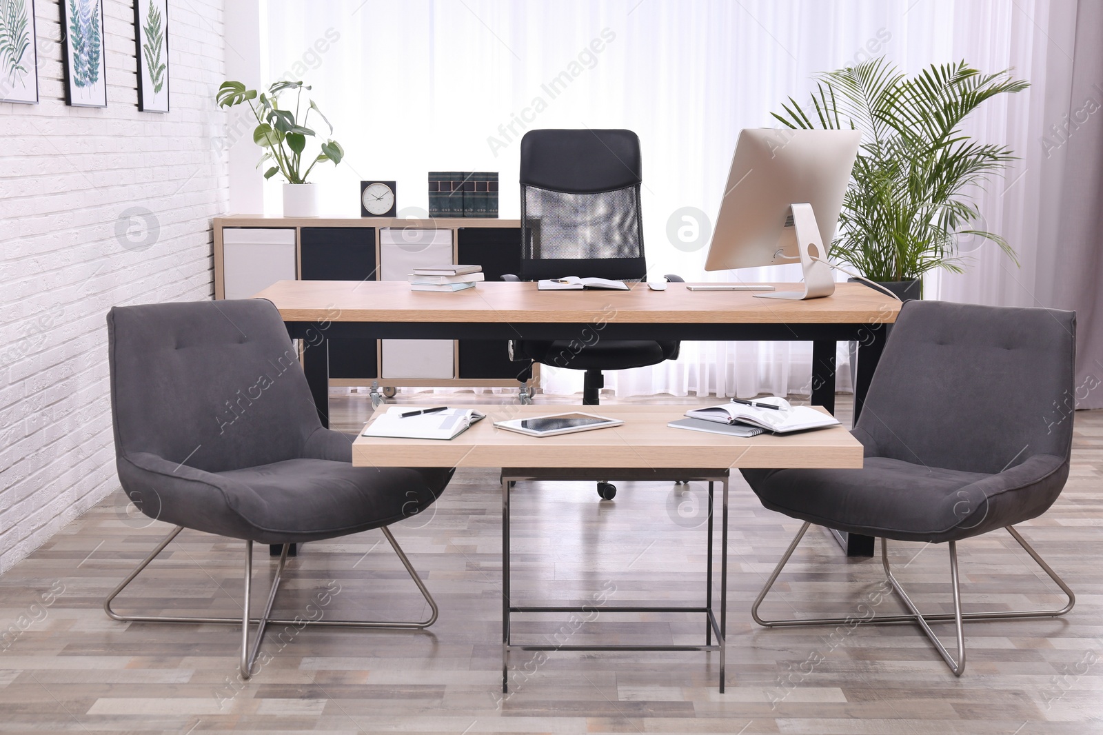 Photo of Director's office with large wooden table. Interior design