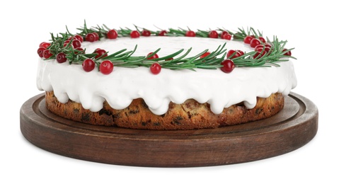 Photo of Traditional Christmas cake decorated with rosemary and cranberries isolated on white