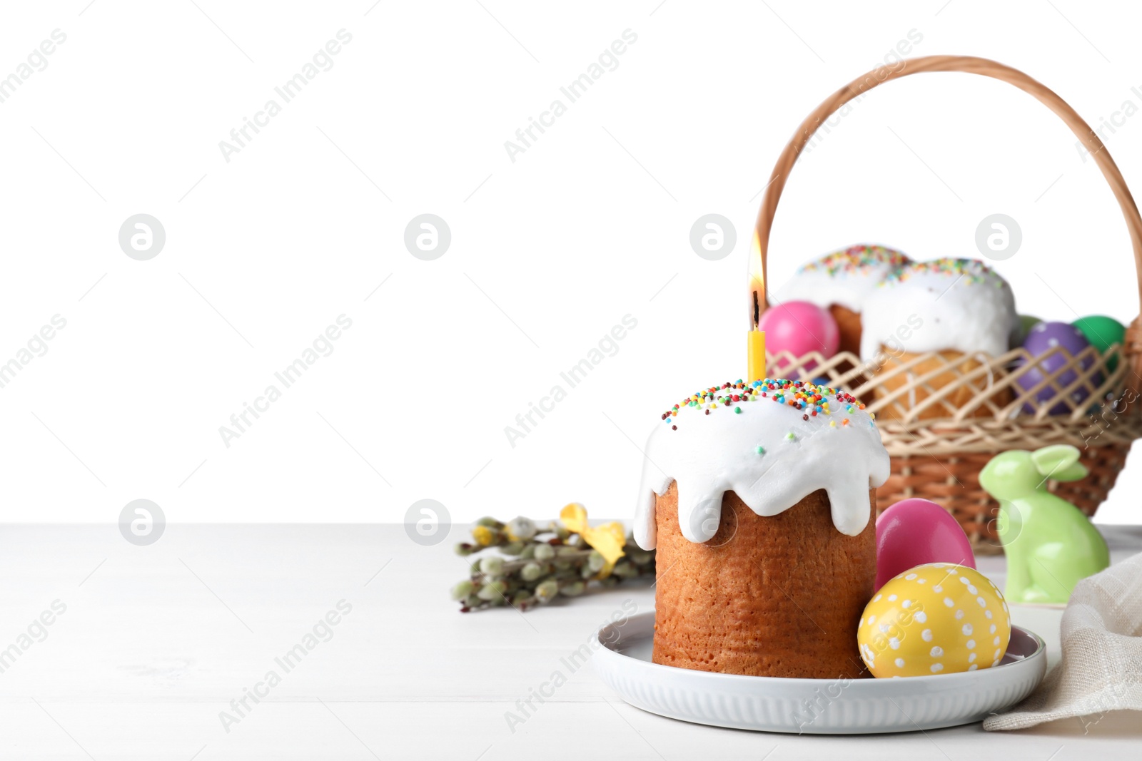 Photo of Easter cake and color eggs on white table, space for text