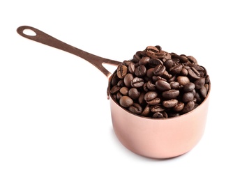 Saucepan with roasted coffee beans on white background