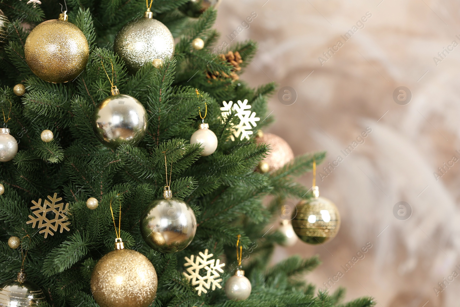 Photo of Beautiful Christmas tree with decor against brown background. Space for text