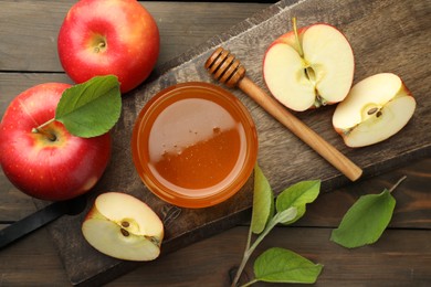Photo of Sweet honey and fresh apples on wooden table, flat lay