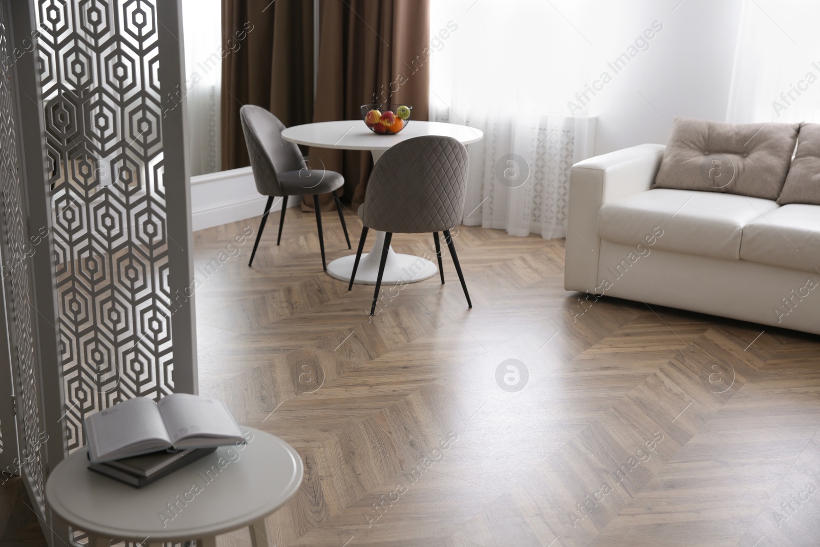 Photo of Modern living room with parquet floor and stylish furniture