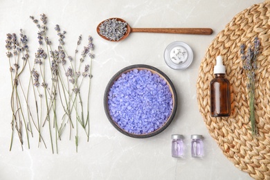 Flat lay composition with lavender flowers and natural cosmetic on light background