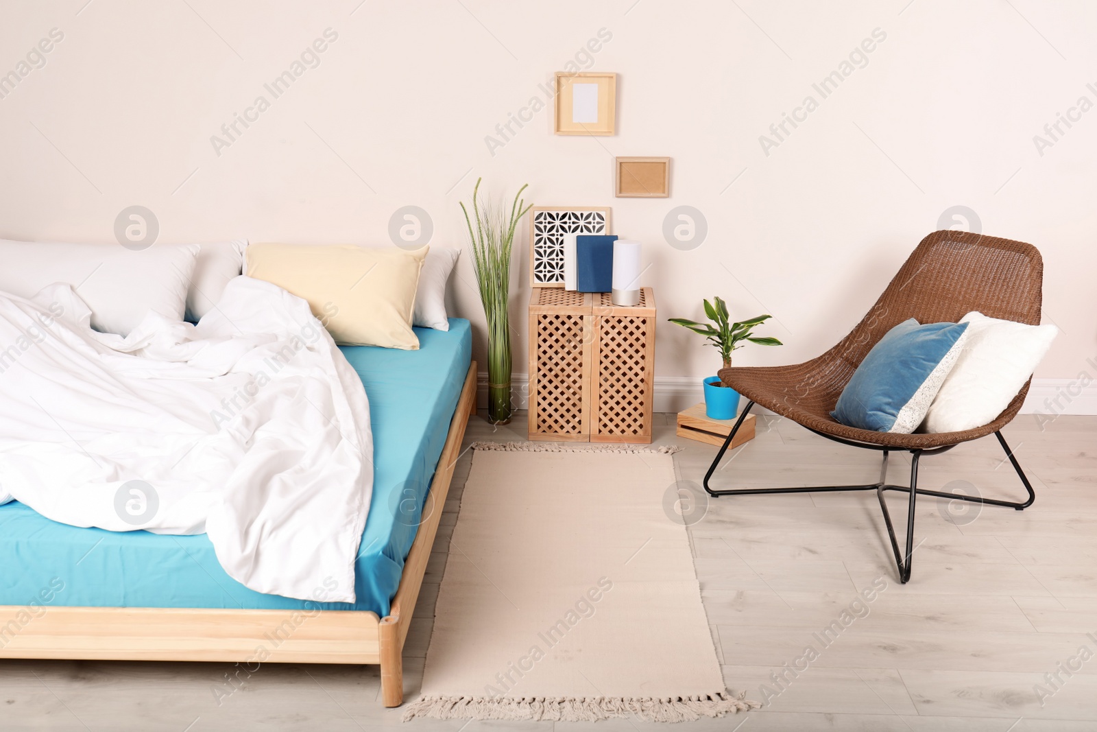 Photo of Modern bedroom interior with comfortable chair. Stylish design