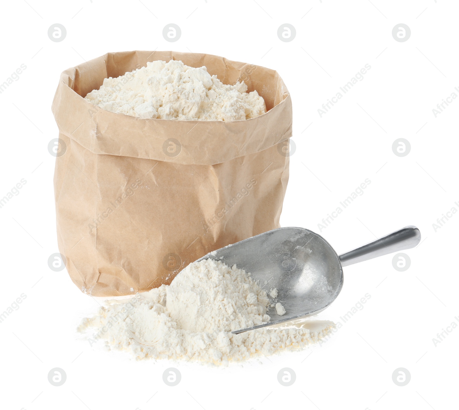 Photo of Paper bag and scoop with flour isolated on white