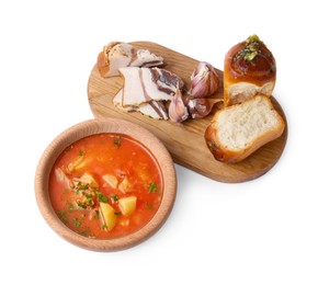 Photo of Delicious borsch served with pampushky and salo on white background. Traditional Ukrainian cuisine