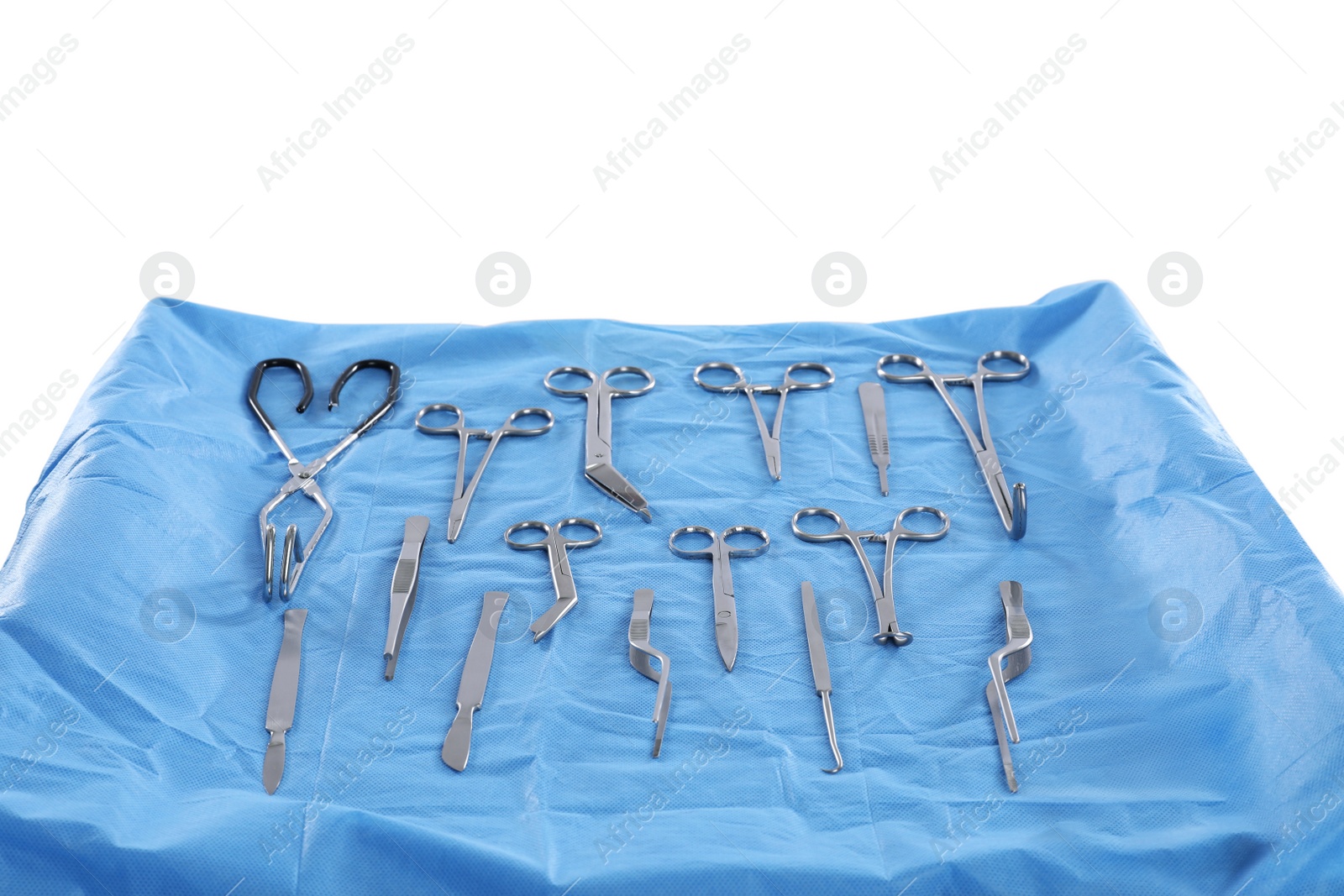 Photo of Different surgical instruments on table against light background