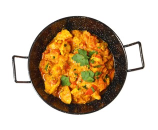 Photo of Delicious chicken curry in frying pan isolated on white, top view