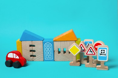 Photo of Set of wooden toys on light blue background. Children's development
