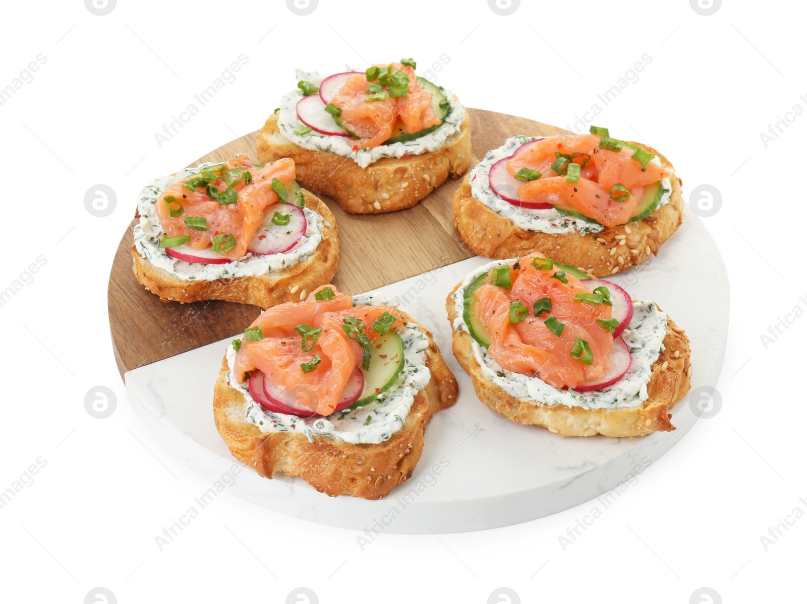 Photo of Tasty canapes with salmon, cucumber, radish and cream cheese isolated on white