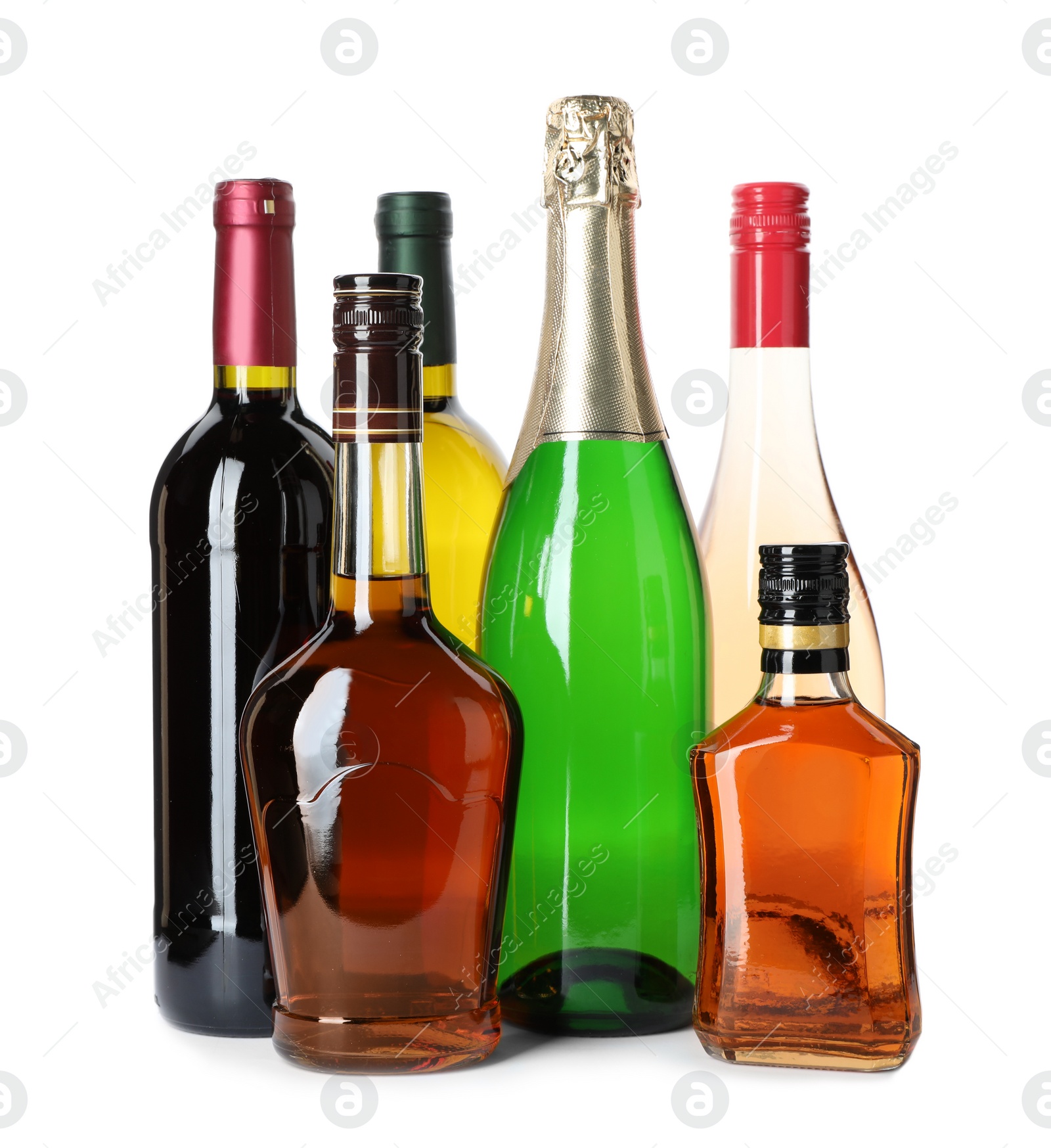 Photo of Bottles with different alcoholic drinks on white background