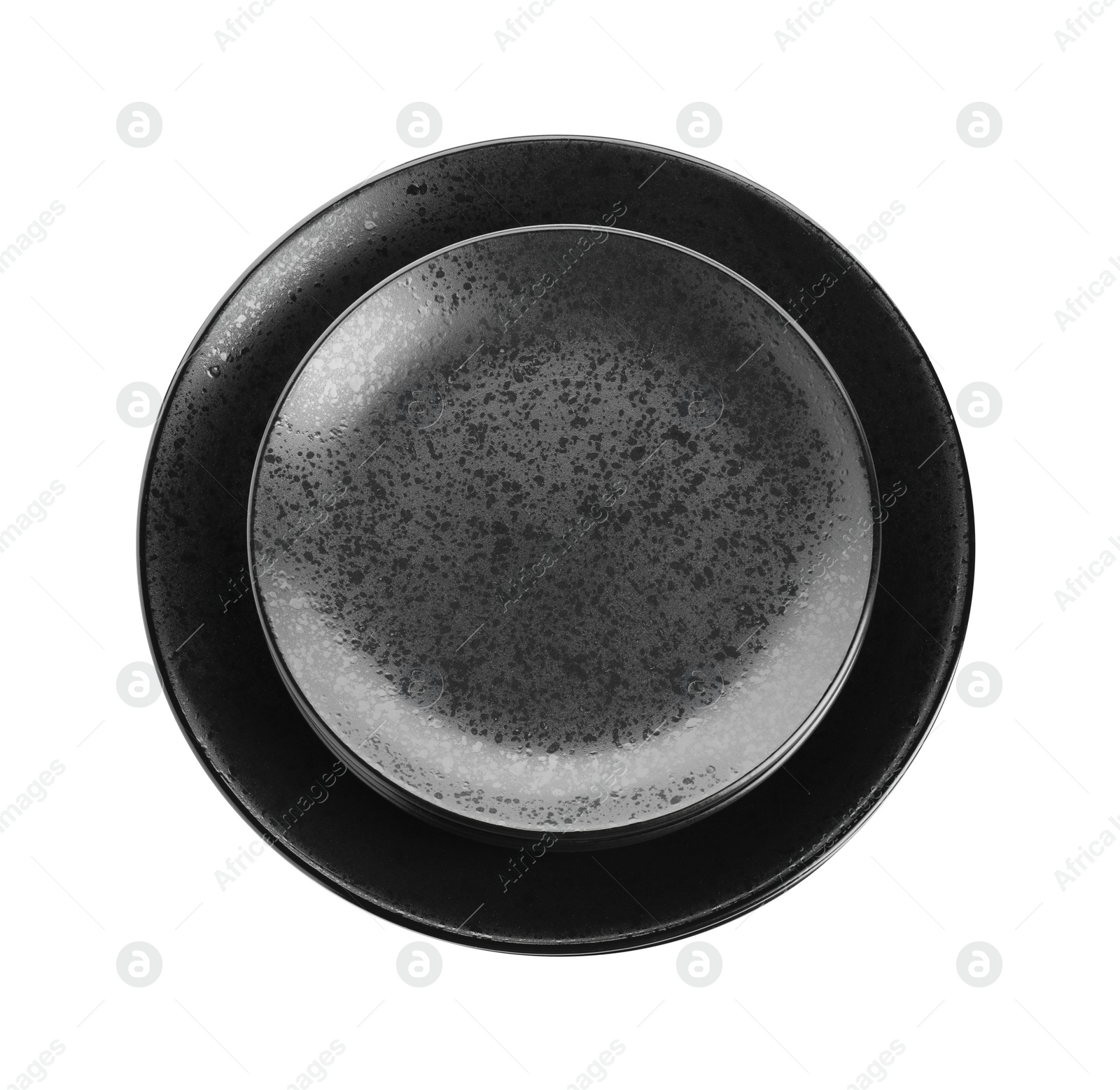 Photo of Stack of black ceramic plates isolated on white, top view