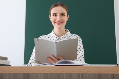 Photo of Portrait of young female teacher in classroom