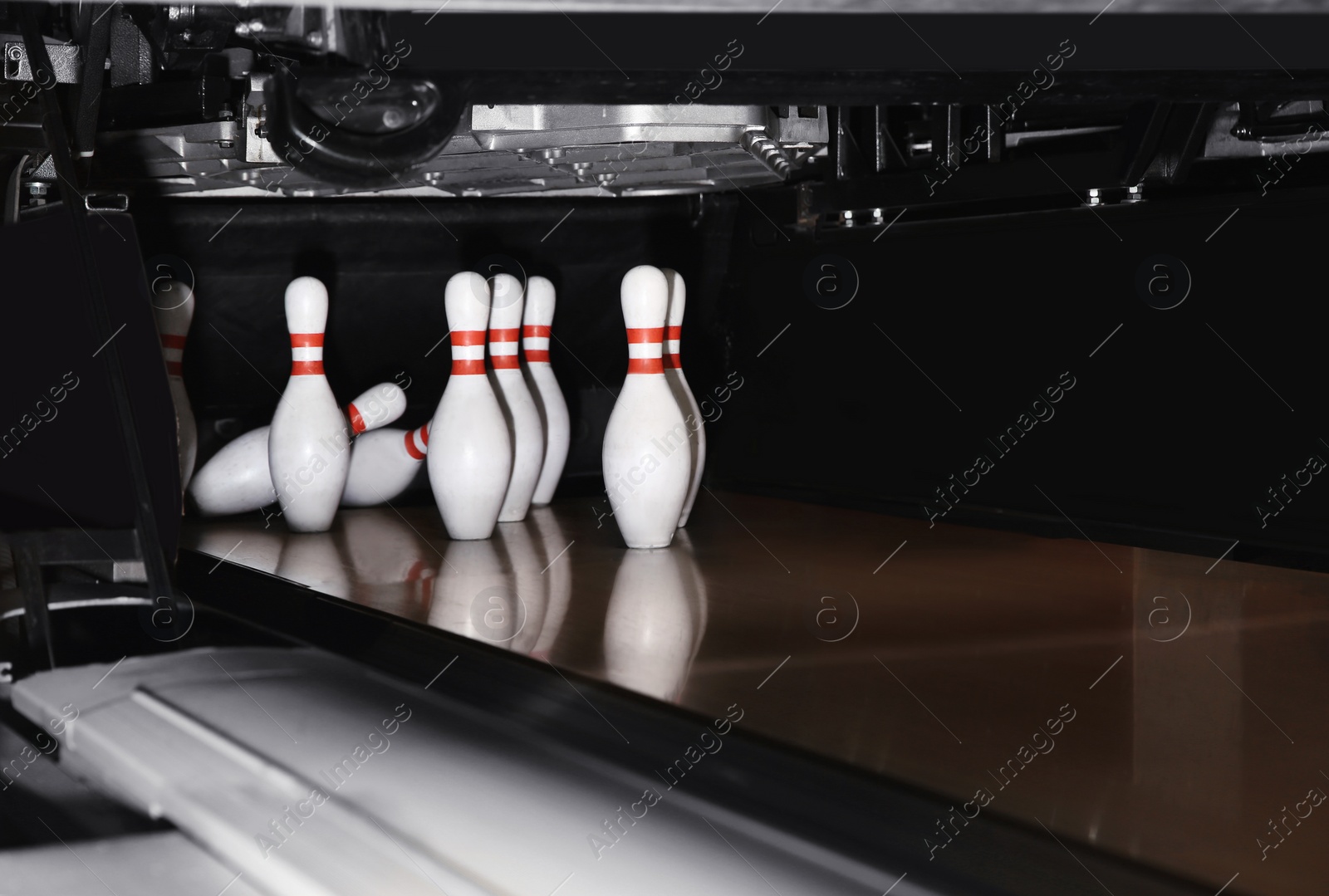 Photo of Pins on alley lane in bowling club