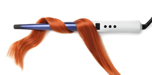 Modern curling iron with red hair lock on white background, top view