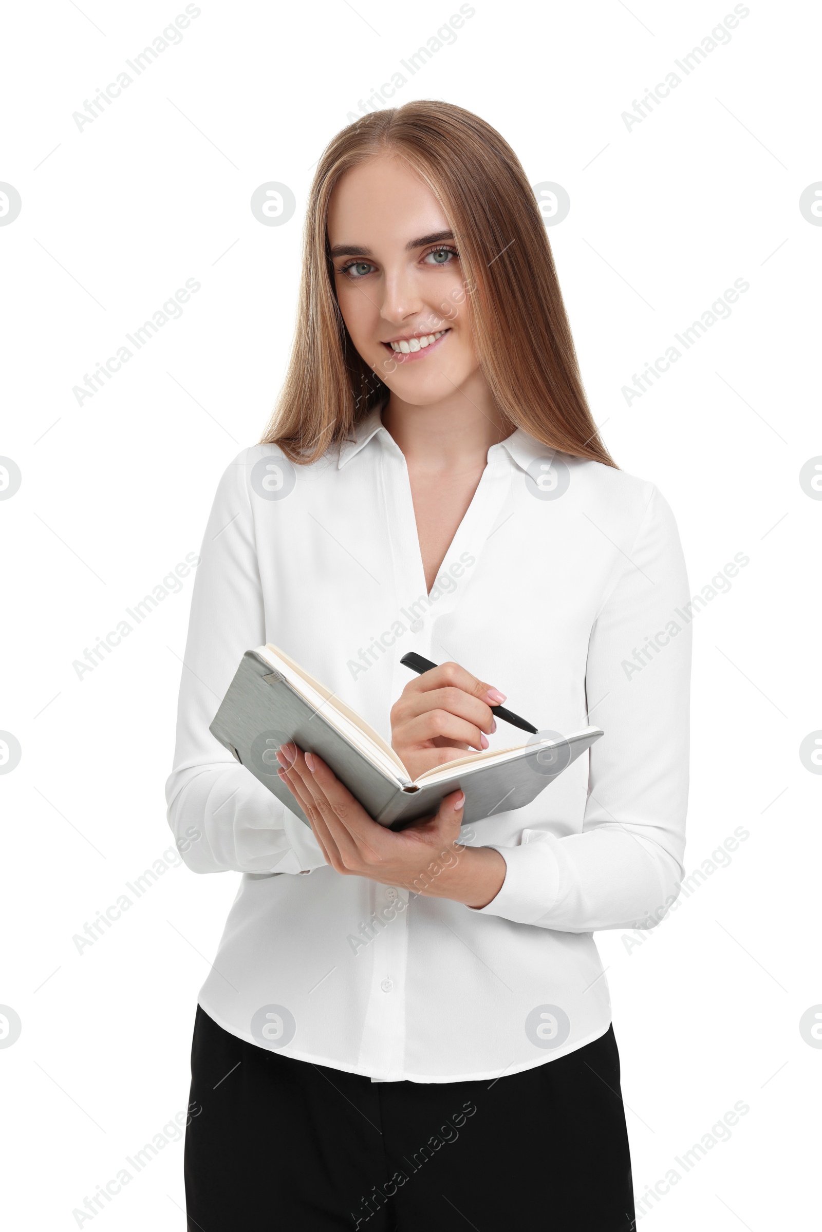 Photo of Happy young secretary writing in notebook on white background