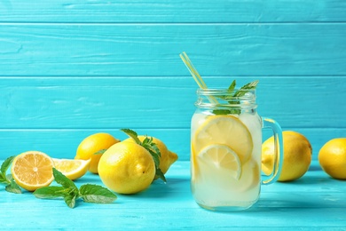 Photo of Natural lemonade in mason jar on wooden table