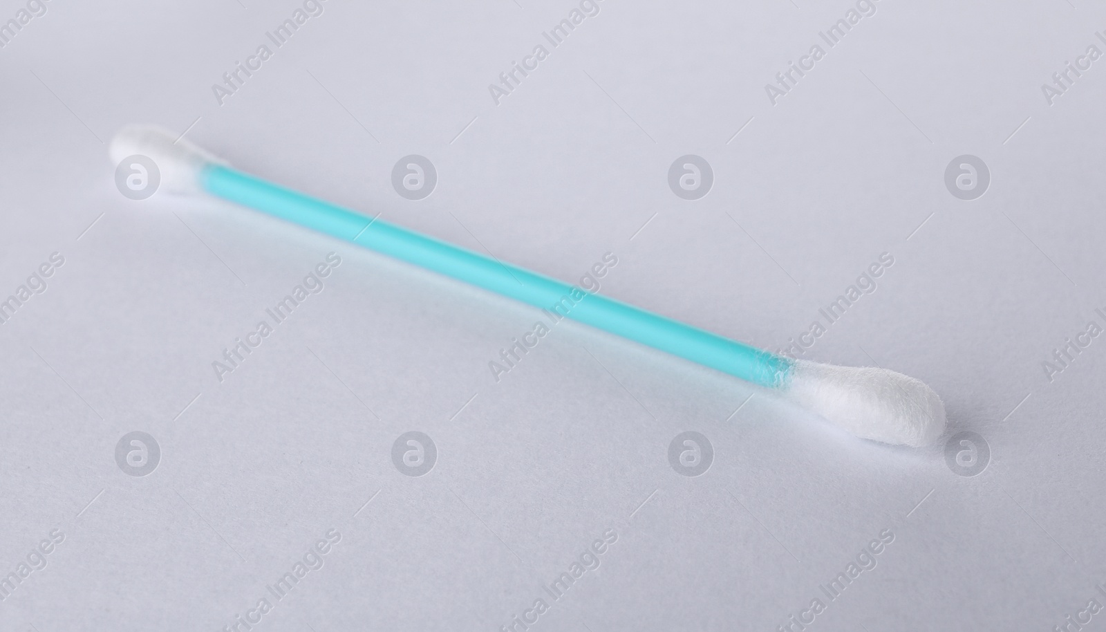 Photo of Clean cotton bud isolated on white. Hygienic accessory