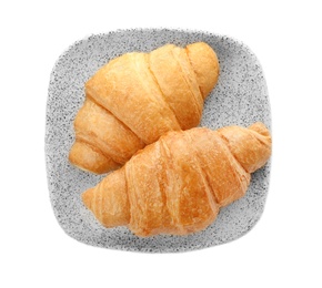 Photo of Plate with tasty croissant on white background, top view