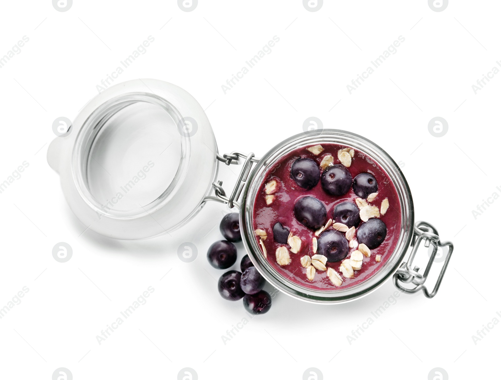 Photo of Jar with tasty acai smoothie on white background, top view