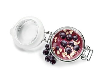 Photo of Jar with tasty acai smoothie on white background, top view