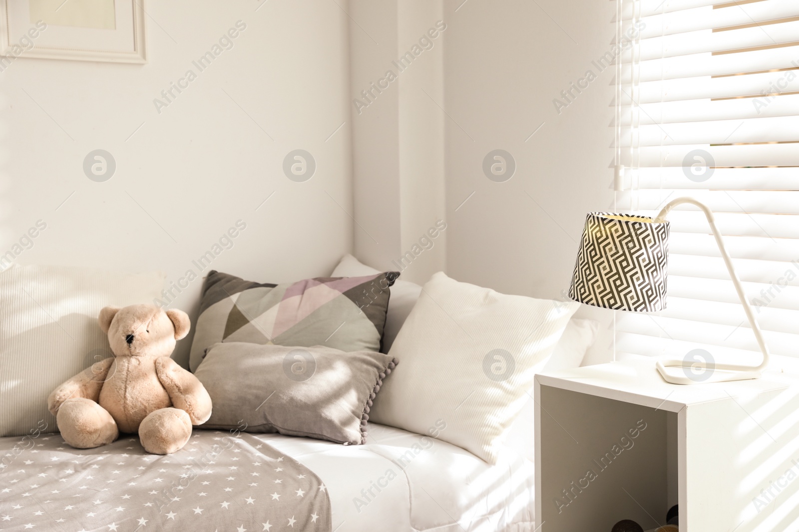 Photo of Modern child room interior with comfortable bed