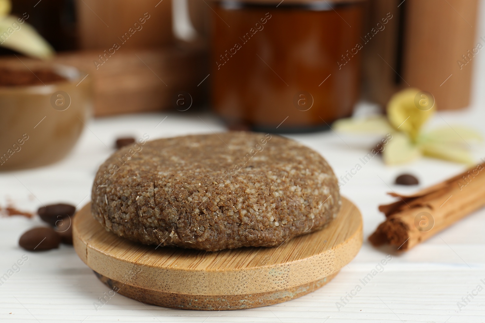 Photo of Homemade cosmetic product on white wooden table, closeup