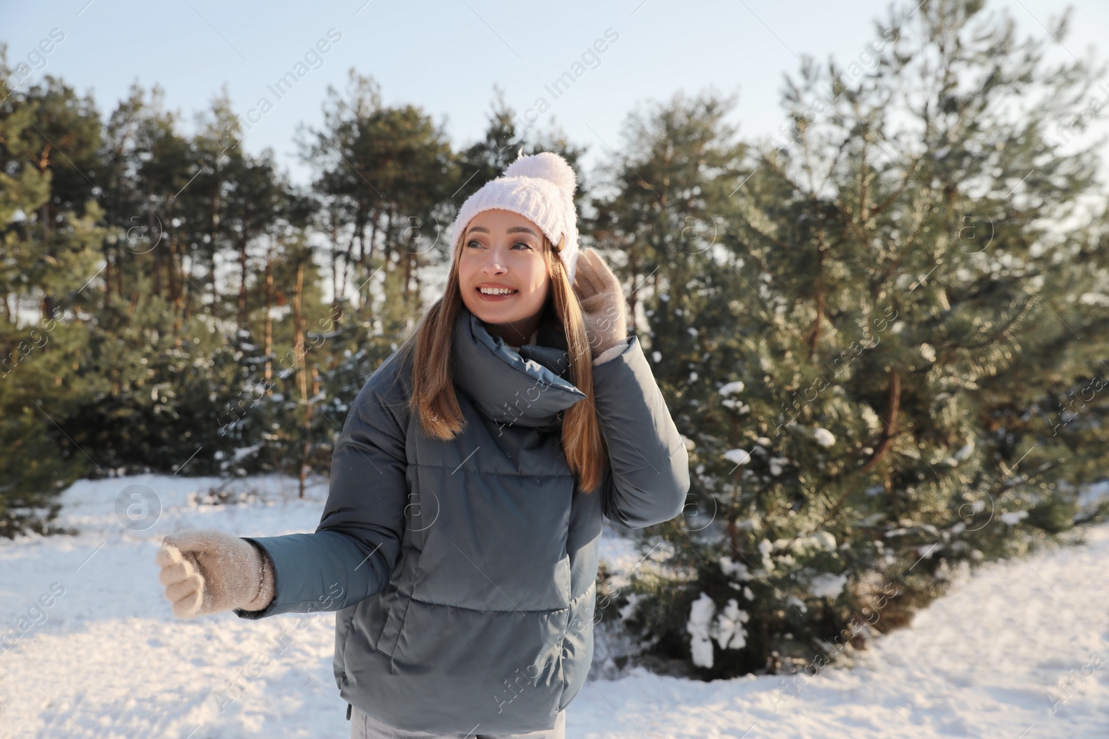 Photo of Woman enjoying winter day in forest, space for text