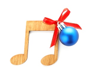 Wooden music note with Christmas ball isolated on white, top view