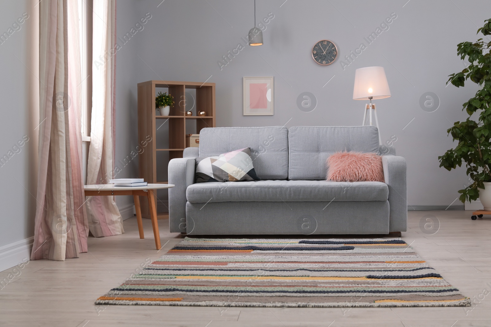 Photo of Modern living room interior with comfortable sofa and beautiful carpet