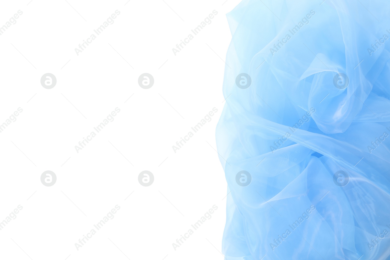 Photo of Beautiful light blue tulle fabric on white background, top view