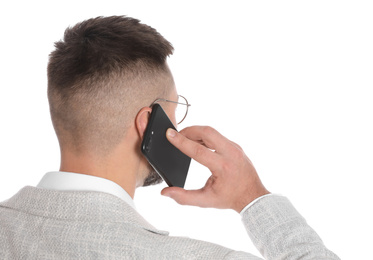 Photo of Businessman talking on mobile phone against white background