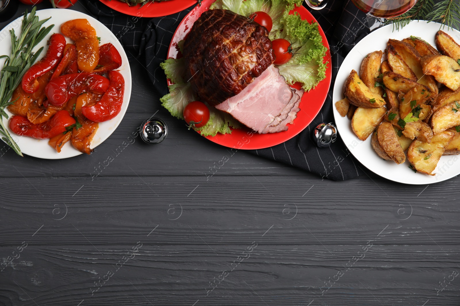 Photo of Flat lay composition with delicious ham on black wooden table. Space for text