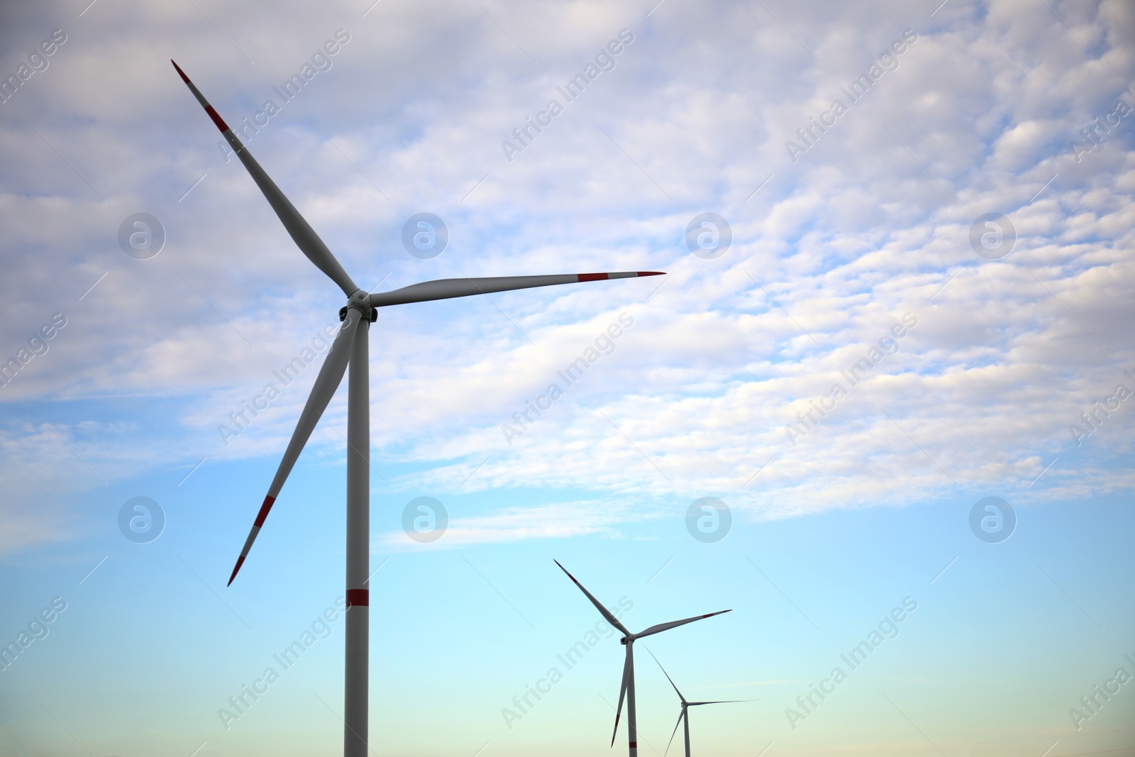 Photo of Wind turbines against beautiful sky. Alternative energy source