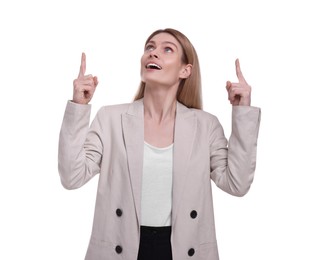 Photo of Beautiful happy businesswoman pointing at something on white background