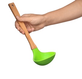 Woman holding soup ladle on white background. Kitchen utensils