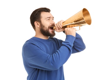 Young man shouting into megaphone on white background
