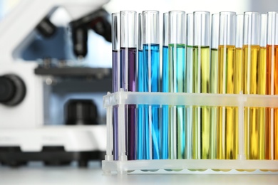 Test tubes with color liquids on table in laboratory