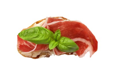 Photo of Tasty sandwich with cured ham and basil leaf isolated on white, top view