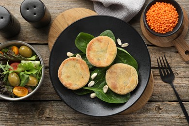 Photo of Healthy food high in vegetable fats on wooden table, flat lay