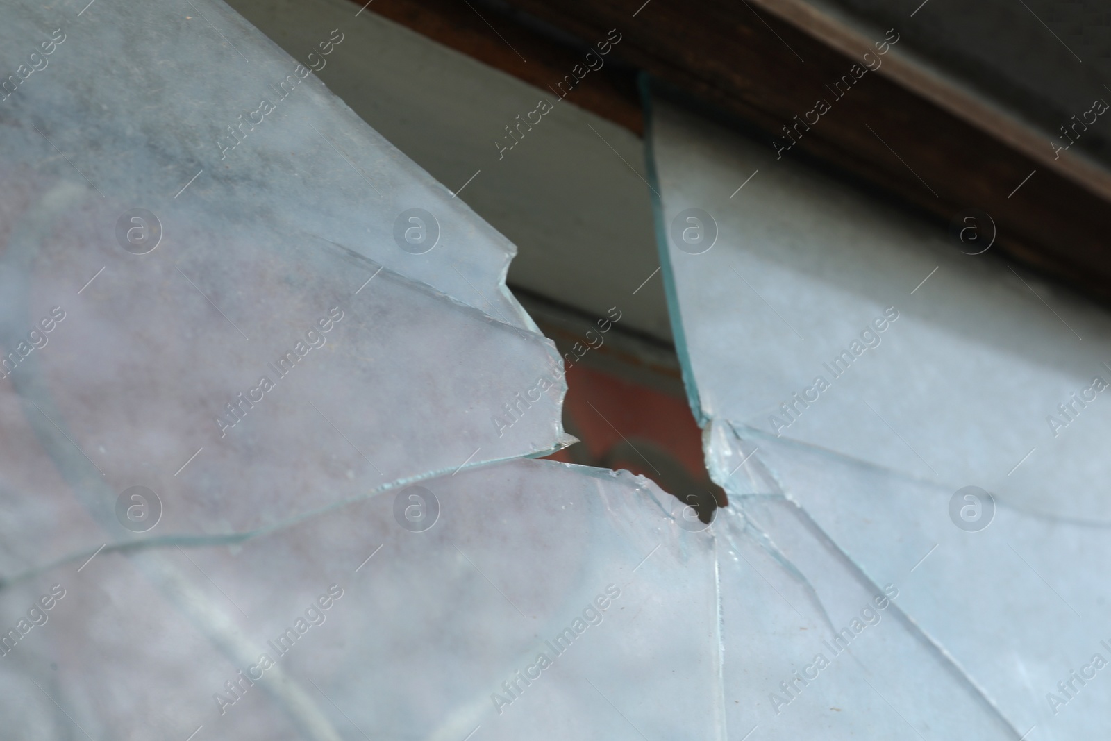 Photo of Broken window of abandoned house outdoors, closeup. Requiring repair