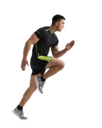 Photo of Athletic young man running on white background, side view