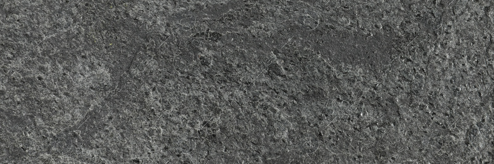 Image of Texture of dark grey stone surface as background, closeup. Banner design