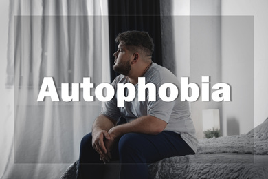 Image of Depressed overweight man sitting alone on bed at home. Autophobia - fear of isolation