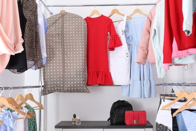 Modern dressing room with different stylish clothes and accessories