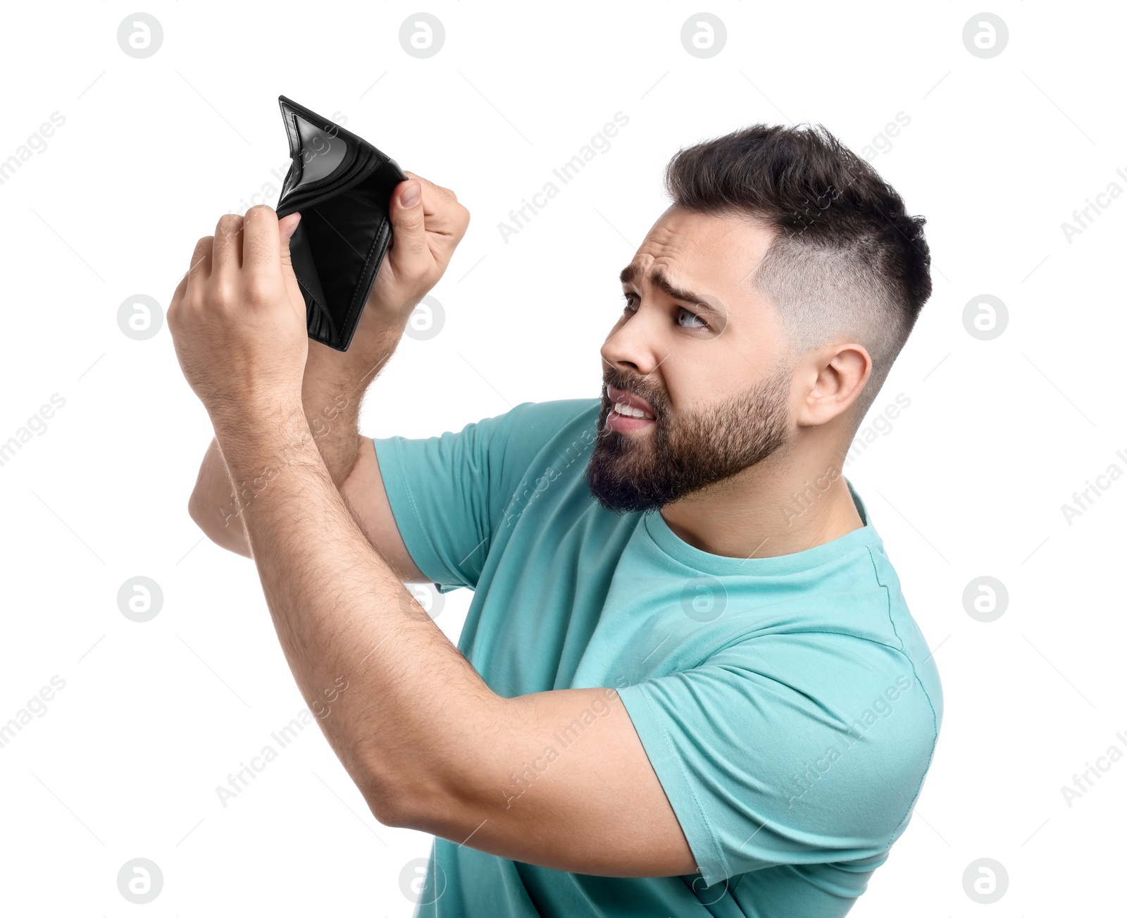 Photo of Upset man showing empty wallet on white background