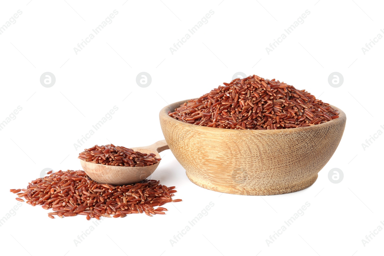 Photo of Bowl and spoon with uncooked brown rice on white background